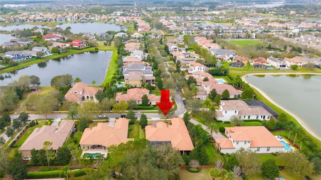 bird's eye view with a water view and a residential view