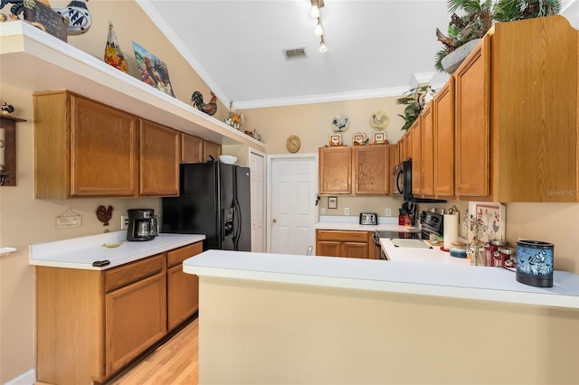 4222 Gold Rush Ln, Saint Cloud, FL 34772 - kitchen with a peninsula, visible vents, light countertops, ornamental molding, and black appliances