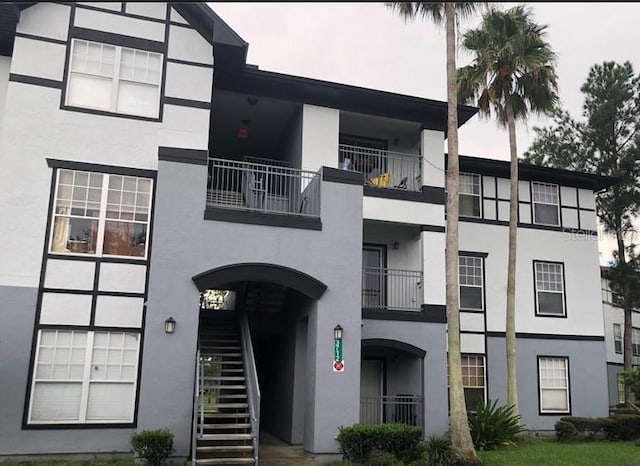 view of property featuring stairs