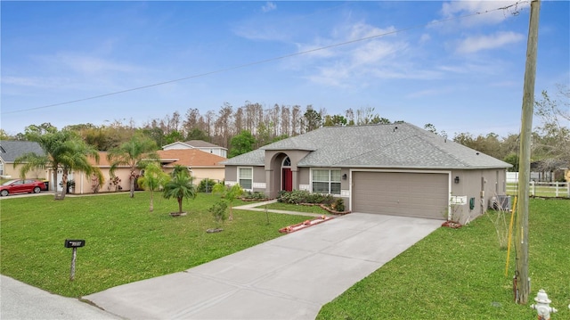 ranch-style house with stucco siding, concrete driveway, and a front yard