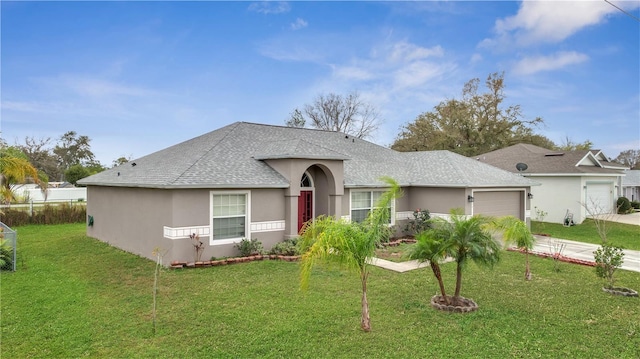 ranch-style home with a front lawn, concrete driveway, an attached garage, and stucco siding