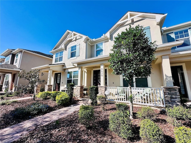 craftsman house featuring stucco siding