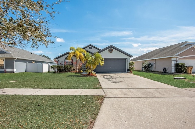 ranch-style home with an attached garage, concrete driveway, a front yard, and stucco siding