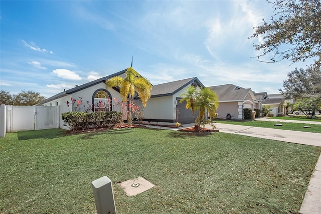 view of front facade with driveway, a garage, a gate, and a front yard