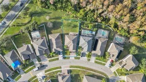 birds eye view of property with a residential view