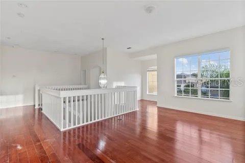 unfurnished room with dark wood-style flooring