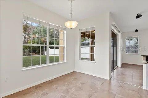 unfurnished dining area featuring baseboards