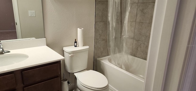 bathroom featuring toilet, shower / tub combo, vanity, and a textured wall