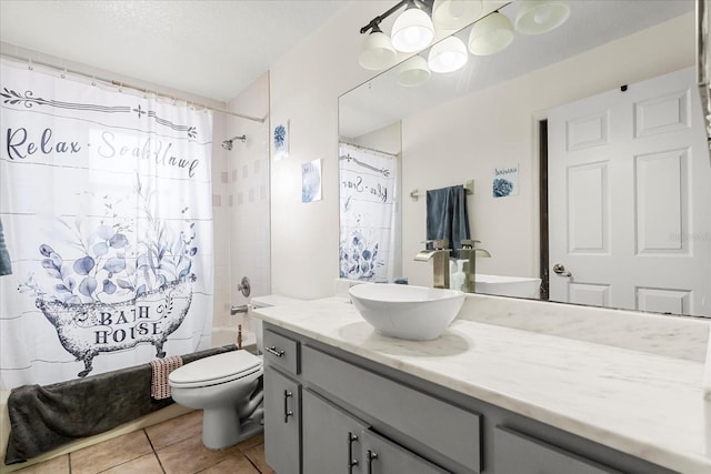 bathroom with toilet, shower / bath combo, a textured ceiling, vanity, and tile patterned floors