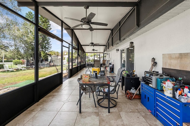 sunroom featuring a ceiling fan