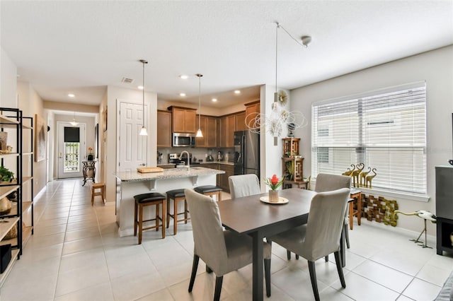 dining area featuring recessed lighting, visible vents, baseboards, and light tile patterned flooring