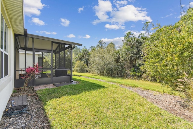 view of yard with a sunroom