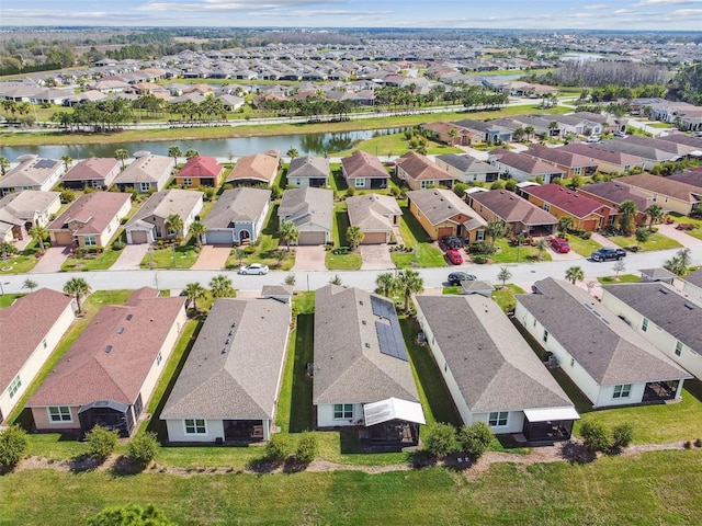 aerial view with a water view and a residential view