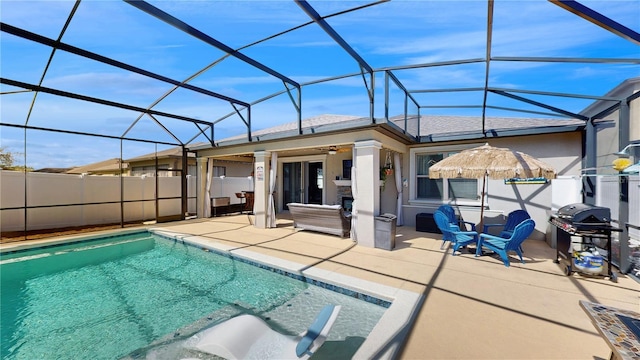 view of pool with a lanai, area for grilling, a ceiling fan, a fenced in pool, and a patio area