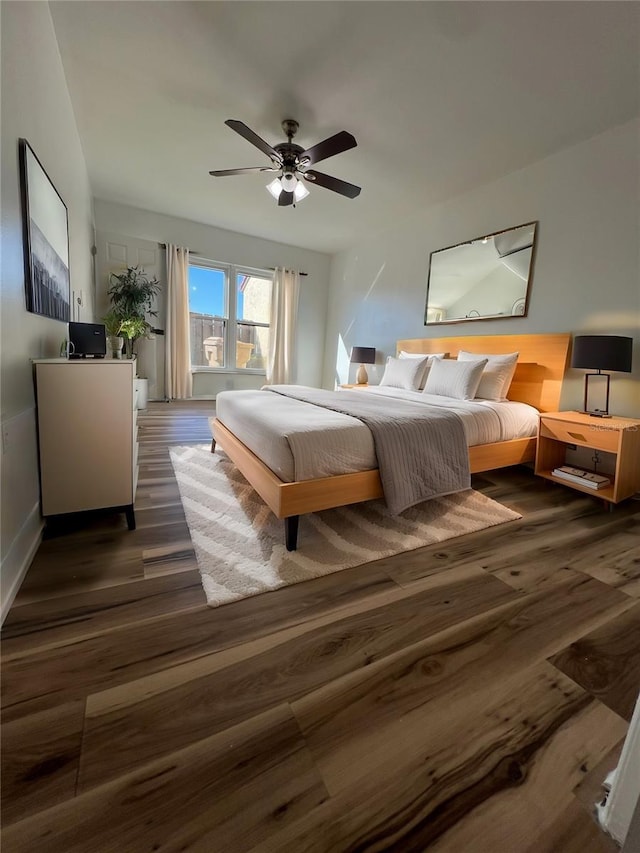 bedroom with ceiling fan and wood finished floors