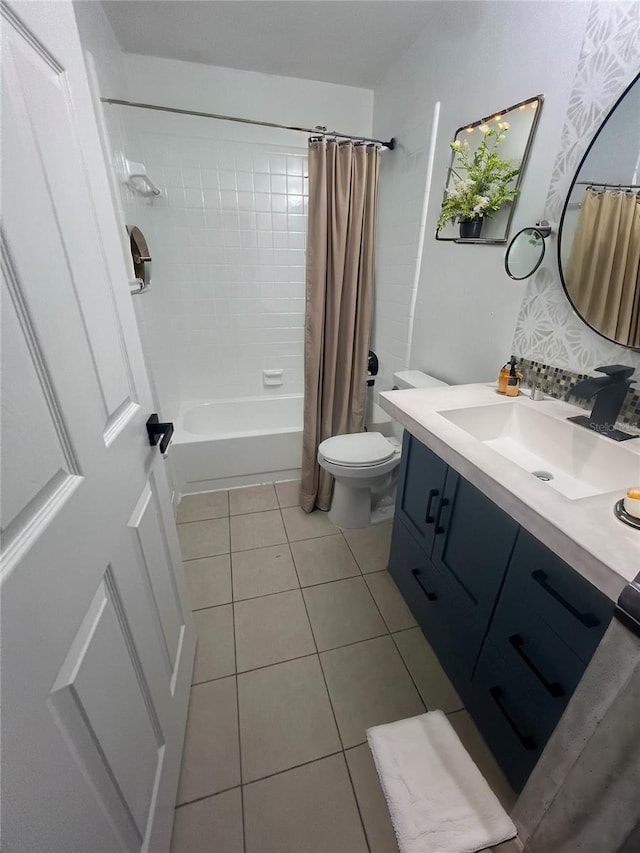 bathroom with toilet, shower / tub combo, tile patterned flooring, and vanity