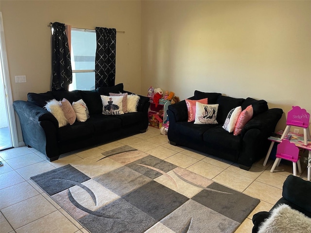 living room with a wealth of natural light and light tile patterned flooring