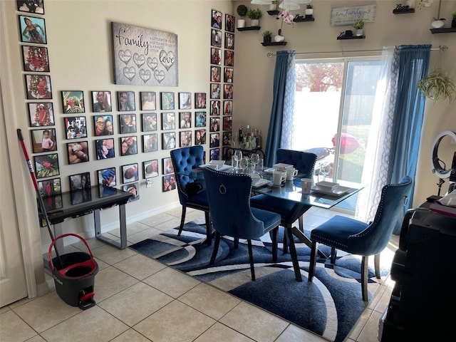 dining space featuring light tile patterned floors