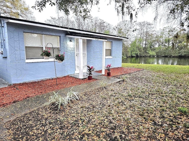 view of front of house featuring a water view