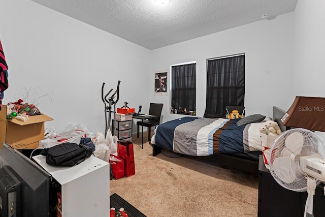 carpeted bedroom featuring a textured ceiling