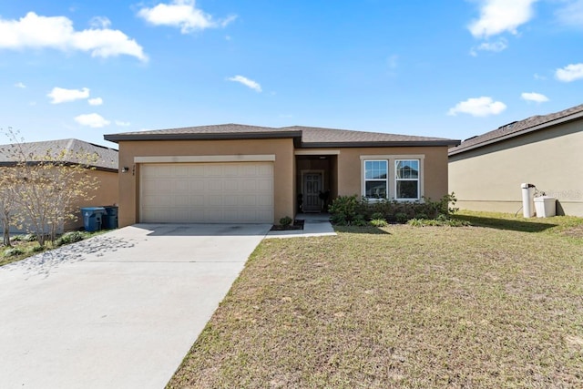 view of front of home with a front lawn, driveway, an attached garage, and stucco siding