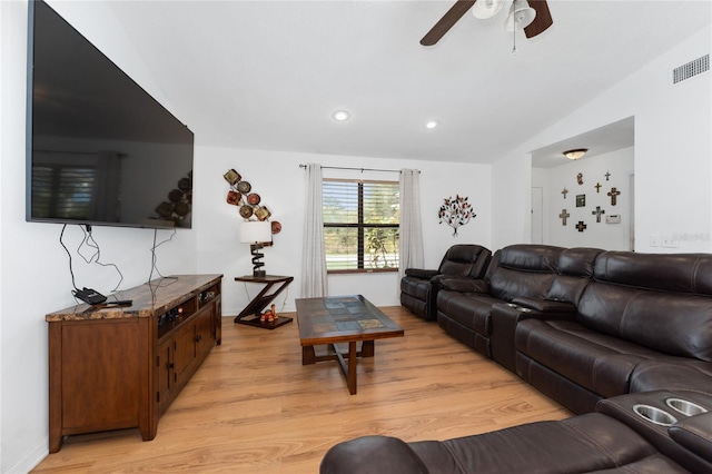 living room with light wood finished floors, visible vents, lofted ceiling, ceiling fan, and recessed lighting