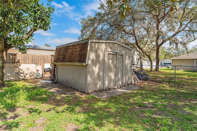 view of shed with a fenced backyard