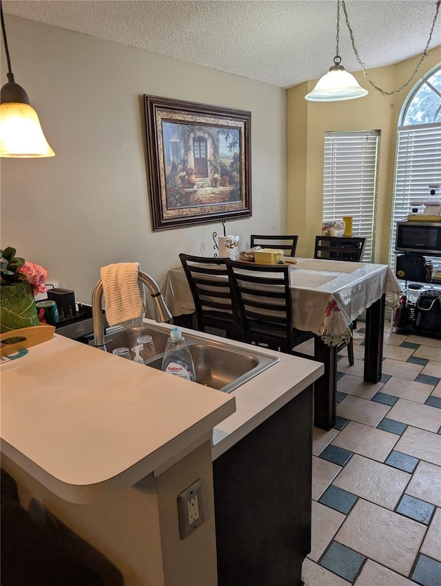 dining area with a textured ceiling