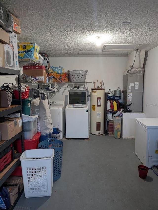 interior space featuring water heater, independent washer and dryer, and heating unit