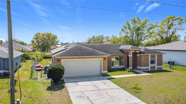 ranch-style home with stucco siding, a front lawn, roof with shingles, concrete driveway, and a garage