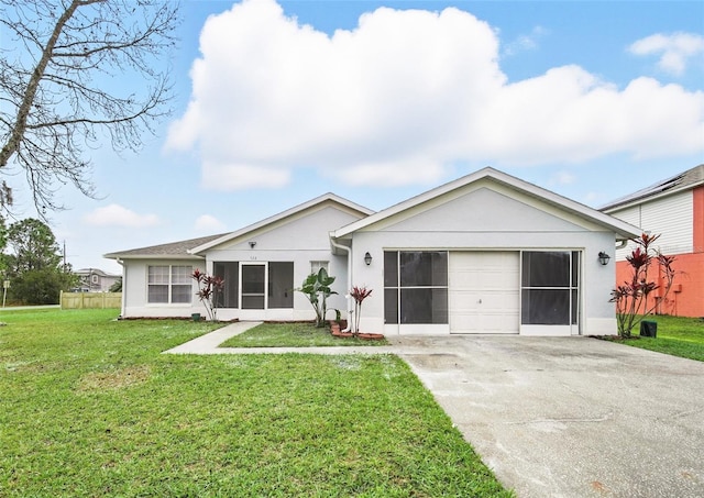 ranch-style home with driveway, a front lawn, an attached garage, and stucco siding