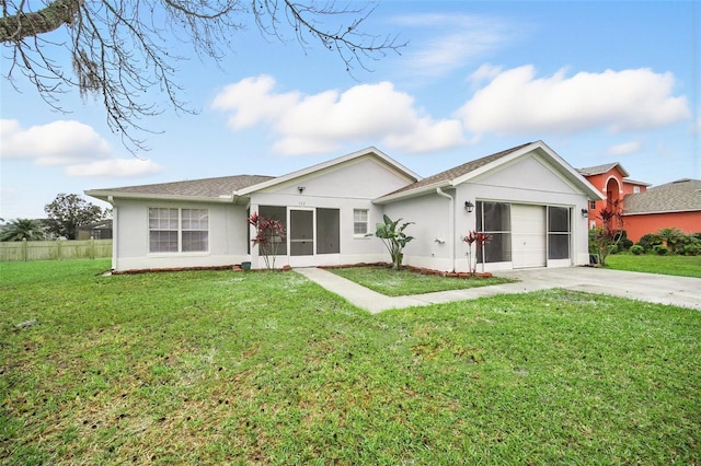 ranch-style home featuring driveway, an attached garage, a front lawn, and stucco siding