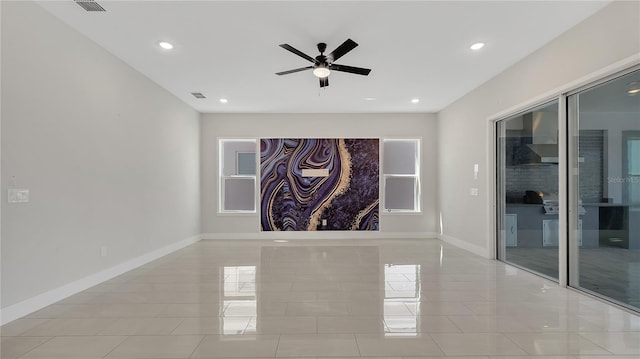 unfurnished room with visible vents, a ceiling fan, recessed lighting, light tile patterned floors, and baseboards