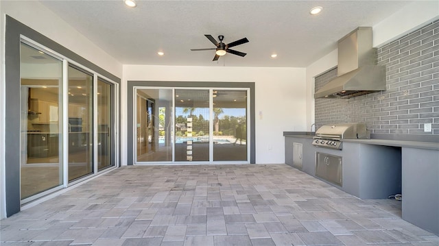 view of patio with area for grilling and an outdoor kitchen