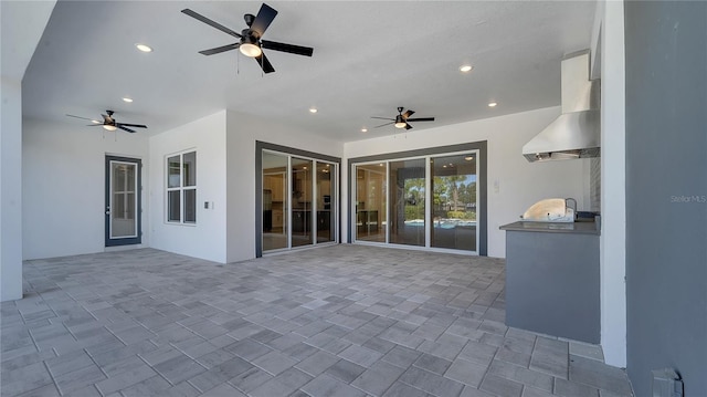 view of patio featuring exterior kitchen and ceiling fan