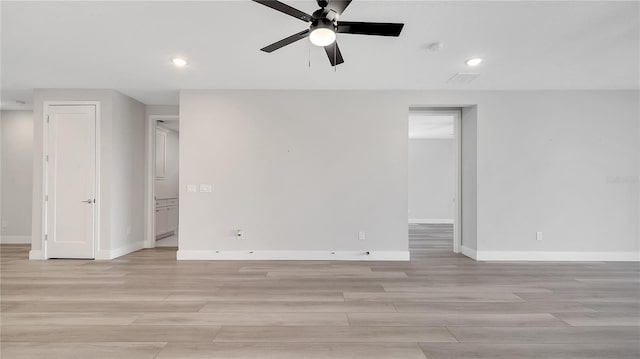 unfurnished room with recessed lighting, baseboards, a ceiling fan, and light wood finished floors