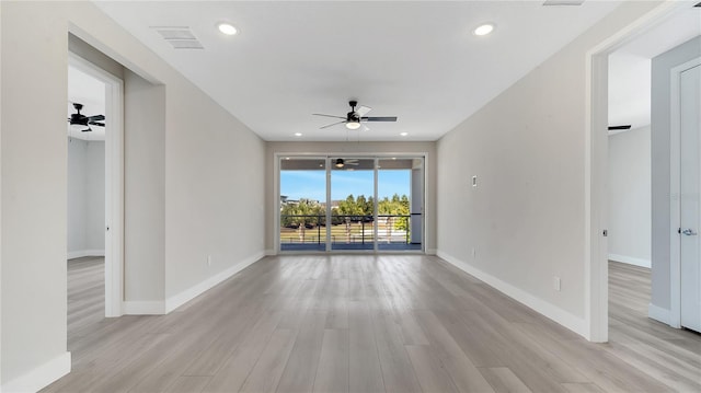 unfurnished room featuring visible vents, recessed lighting, light wood-style floors, baseboards, and ceiling fan