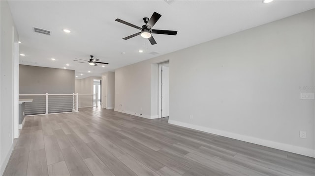 spare room featuring baseboards, visible vents, recessed lighting, ceiling fan, and light wood-style floors