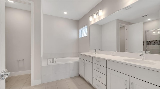 bathroom with a sink, visible vents, a garden tub, and a shower stall