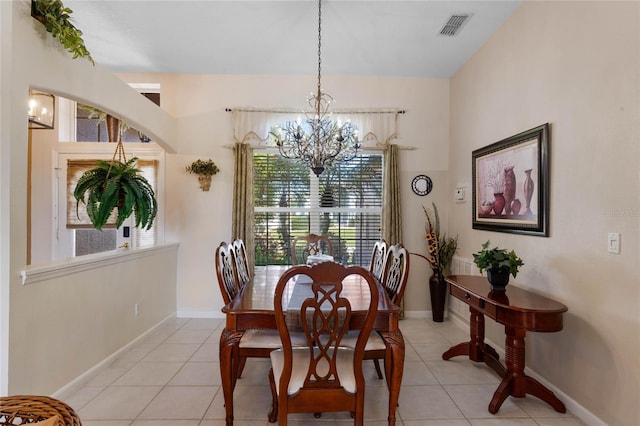 dining space featuring light tile patterned floors, visible vents, a chandelier, and baseboards