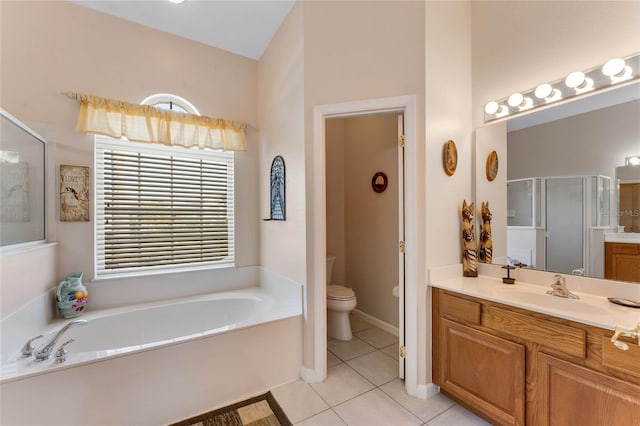 full bathroom with a stall shower, toilet, tile patterned floors, vanity, and a bath