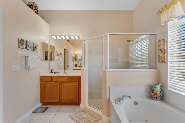 full bathroom featuring vanity, baseboards, a jetted tub, tile patterned floors, and a stall shower