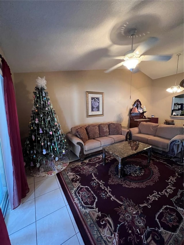 3449 Village Green Ct, Saint Cloud, FL 34772 - living area with a ceiling fan, tile patterned flooring, lofted ceiling, and a textured ceiling