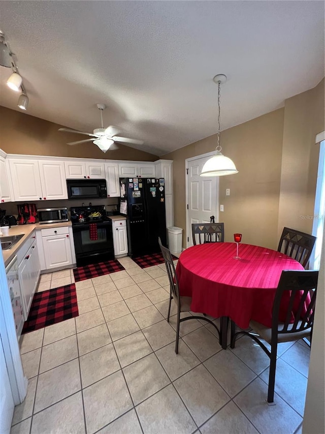 3449 Village Green Ct, Saint Cloud, FL 34772 - dining room featuring lofted ceiling, ceiling fan, a textured ceiling, and light tile patterned floors