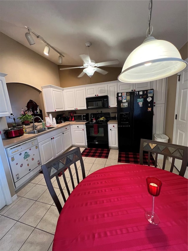 3449 Village Green Ct, Saint Cloud, FL 34772 - interior space with white cabinets, a ceiling fan, black appliances, a sink, and light tile patterned flooring