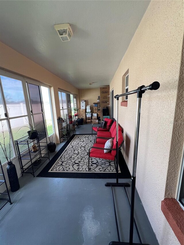 3449 Village Green Ct, Saint Cloud, FL 34772 - exercise area with a textured ceiling and a textured wall