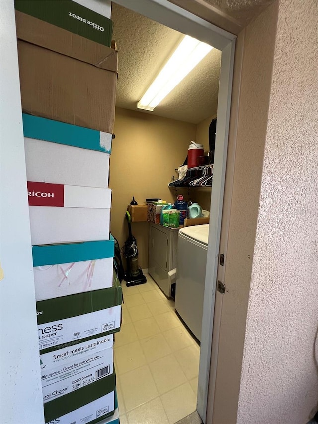 3449 Village Green Ct, Saint Cloud, FL 34772 - clothes washing area featuring laundry area, independent washer and dryer, a textured ceiling, and light floors