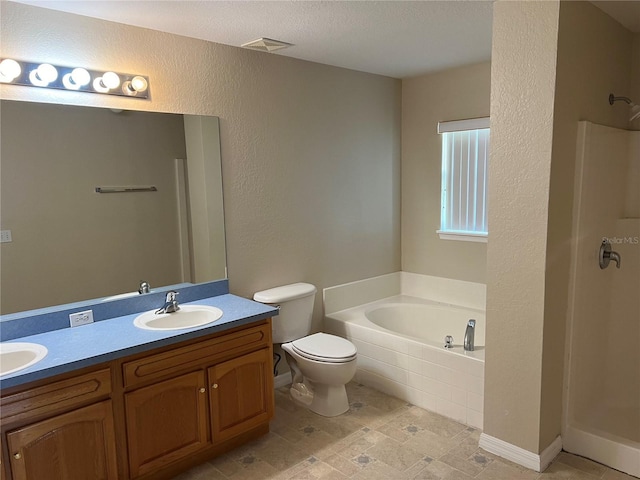 full bathroom featuring a shower stall, toilet, double vanity, a bath, and a sink