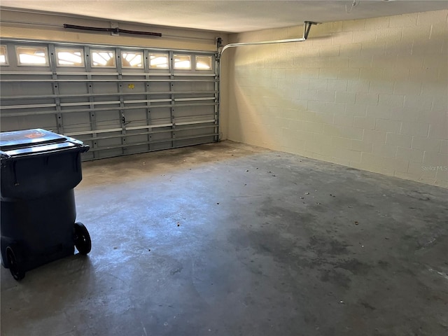 garage with concrete block wall