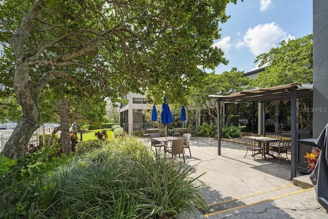 view of patio / terrace featuring fence